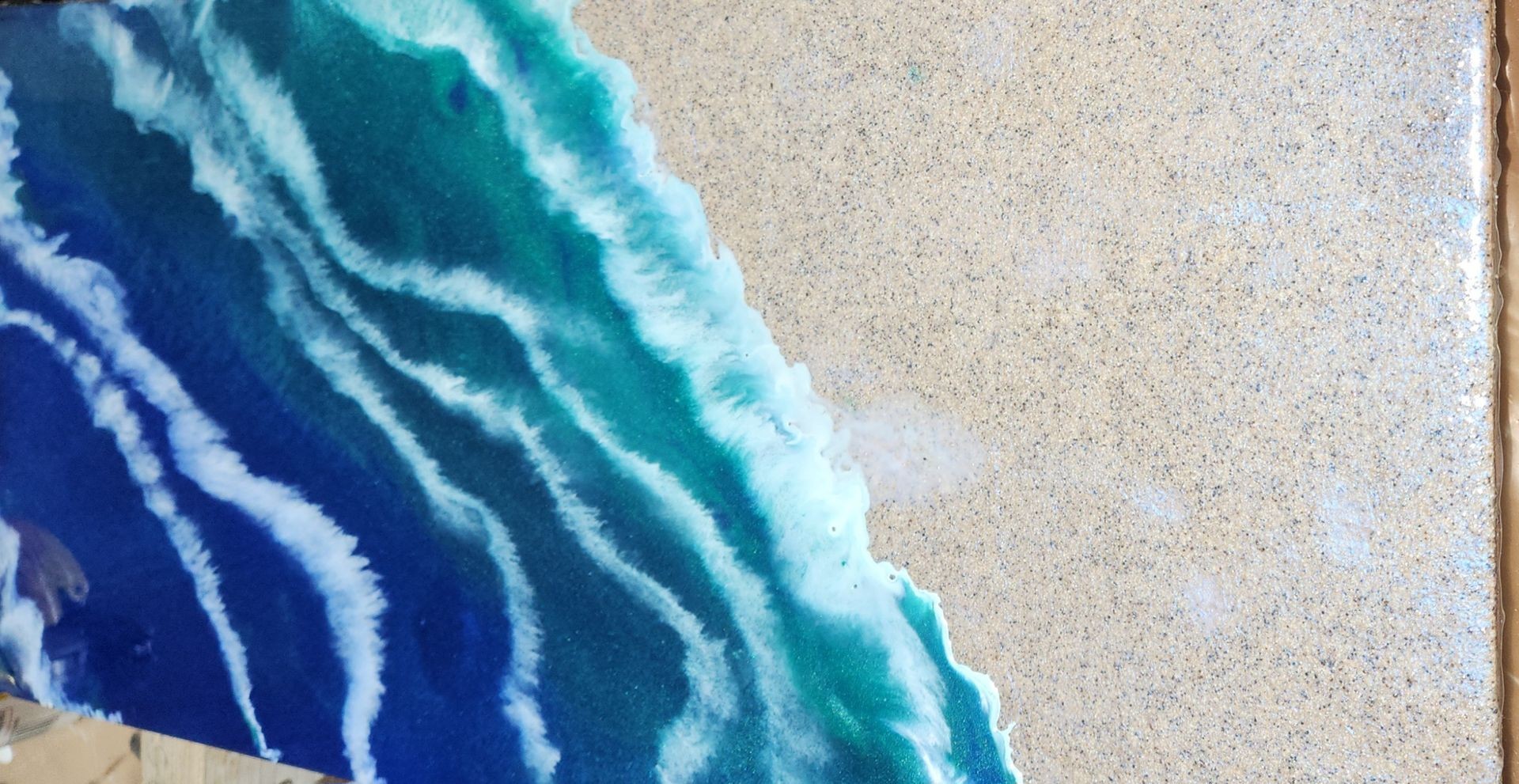 epoxy in sand at the ocean